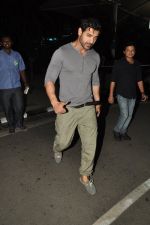 John Abraham snapped at domestic airport in Mumbai on 5th Oct 2014